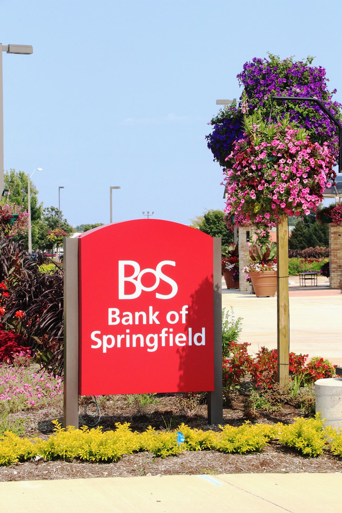 BOS Bank of Springfield sign in front of gardens